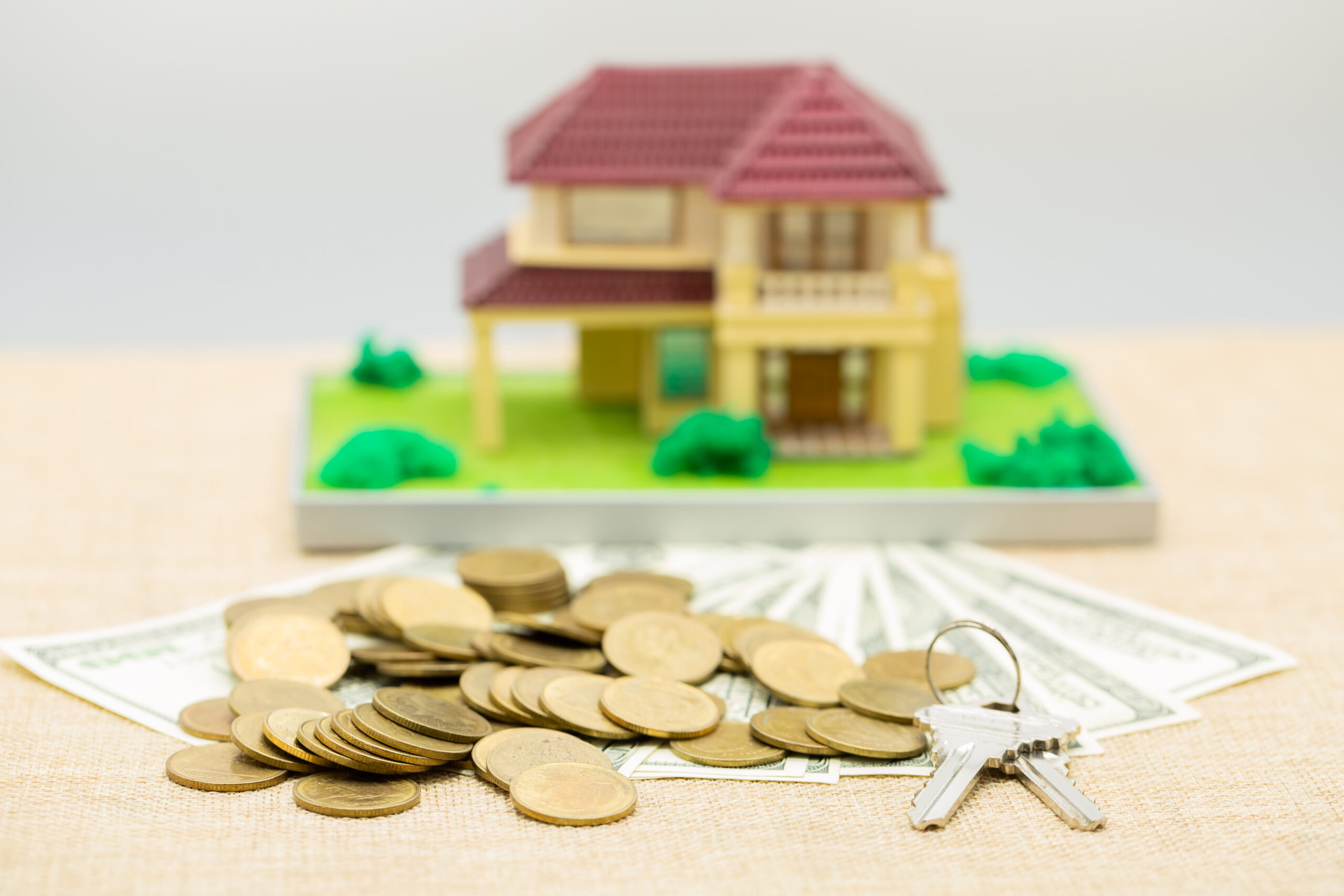 Planning savings money of coins to buy a home concept for proper investment property