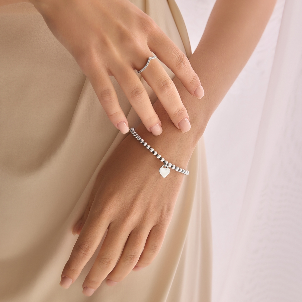Cropped,Close-up,Image,Of,Tender,Female,Hands,Wearing,Silver,Accessories. Which Fashion Accessories Add Instant Charm to Any Outfit